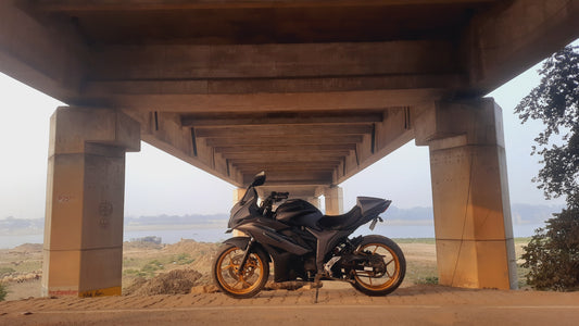 A motorcycle on an open road at sunset, symbolizing freedom and adventure.